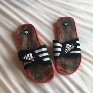 Red and black Adidas Slides